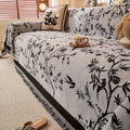 Close-up of jacquard-woven floral texture and soft chenille fabric in olive green showing dimensional botanical motif