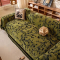 Detail shot of delicate tassel edging along the border of the garden beige floral chenille throw