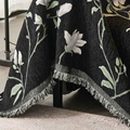 Overhead view of vintage magnolia pattern chenille fabric showing weave texture and color detail