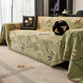 Detail shot of hand-finished tassel fringe along the edge of the chenille sofa cover