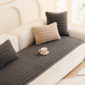 Taupe Sand plush sofa cover styled on a sectional sofa in an earthy-toned living room with natural wood accents