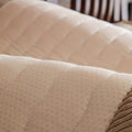 Full room scene with Taupe Sand plush sofa cover on a couch complemented by warm lighting and neutral decor