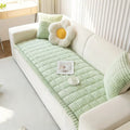 Side angle of pleated flannel sofa cover in Cloud Texture showing drape and tailored edge detail