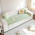 Full sofa styled with the flannel slipcover in Snow Drift in an earthy minimalist living room with plants