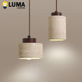Top-down view of natural stone pendant light fixture showing ceiling mount hardware and adjustable cord